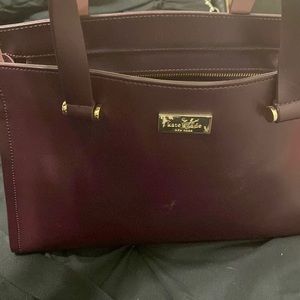 Burgundy Kate spade two strap bag. Used strap shows a little wear and tear.